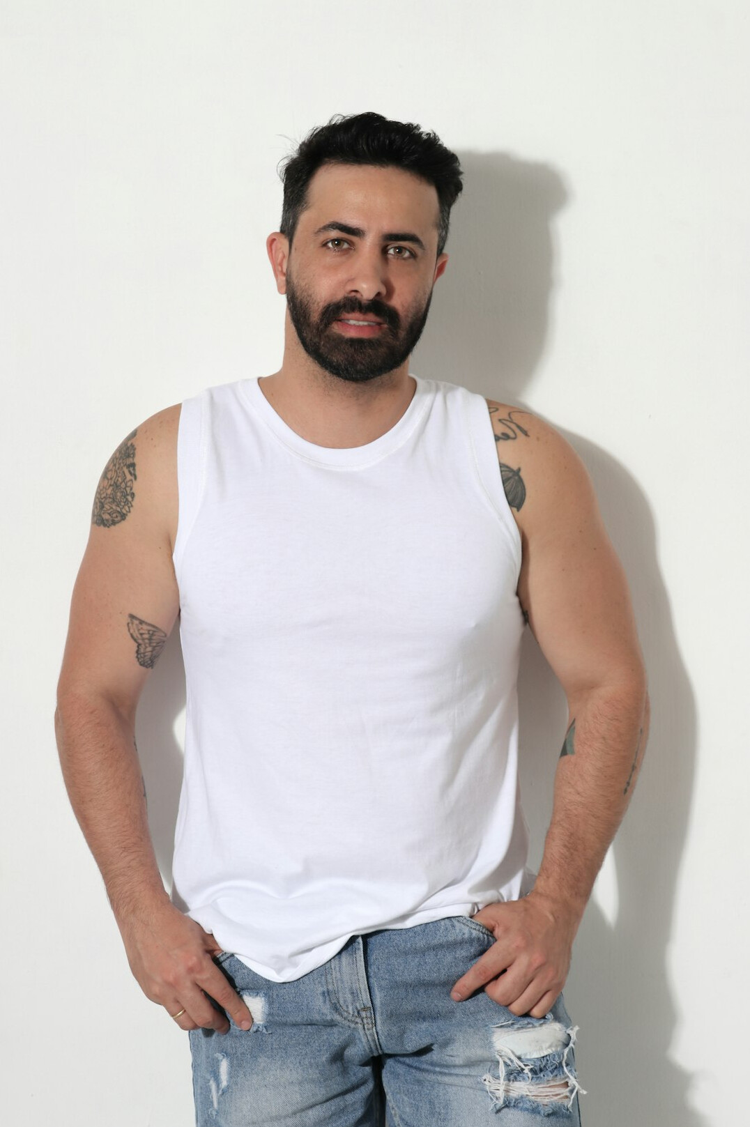 Studio portrait of a Turkish man camera instructor with short dark hair